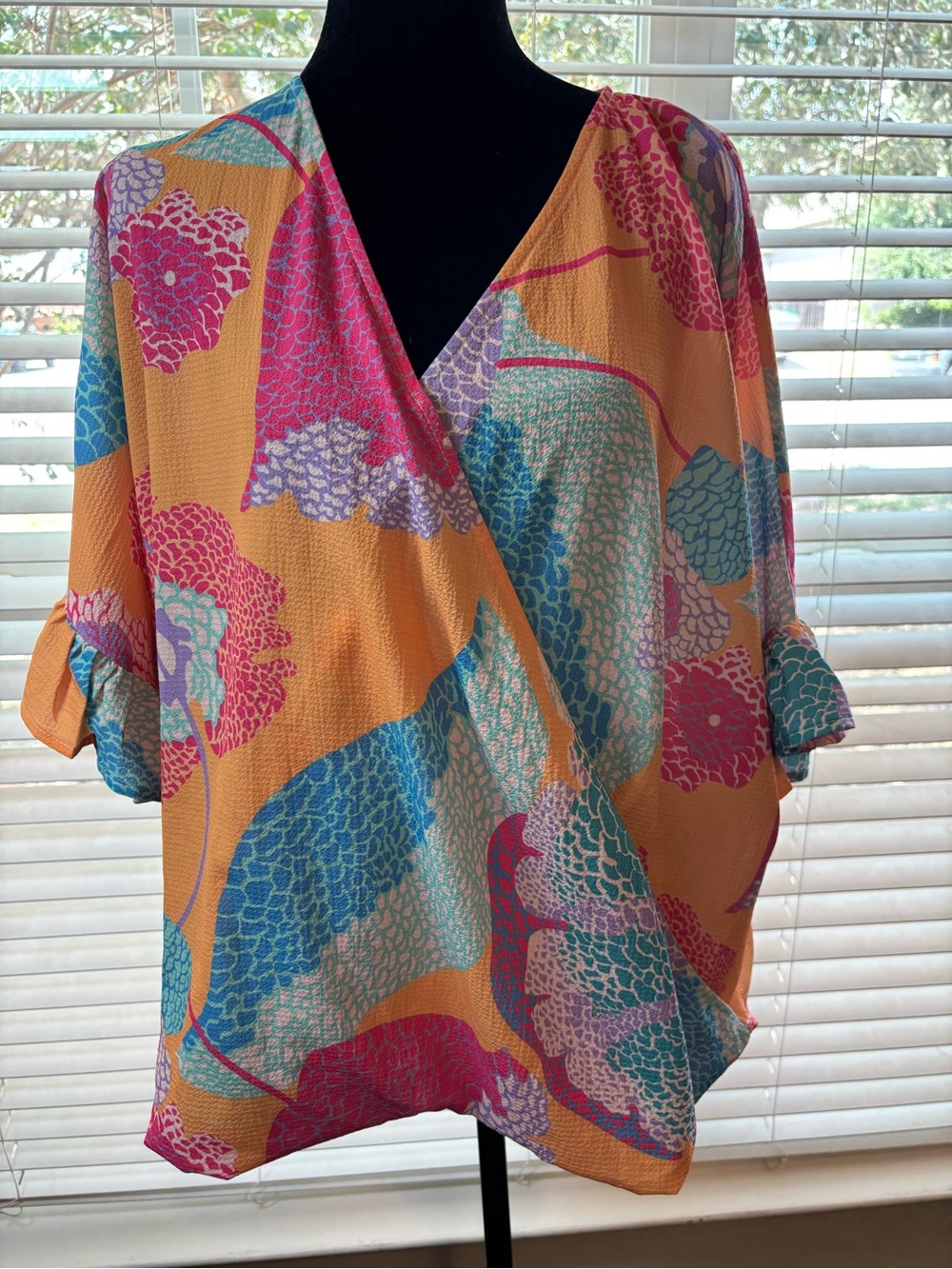 Umgee Orange Floral Wrap-Front Blouse with Multicolor Print